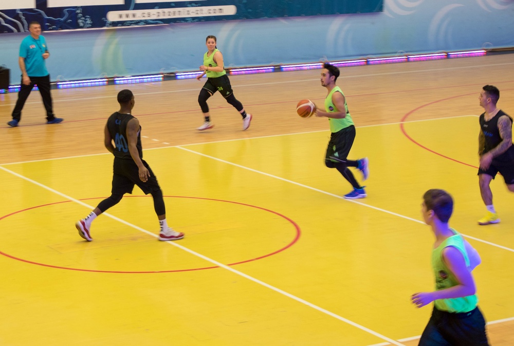 MKAB service members compete in a charity basketball game in Romania