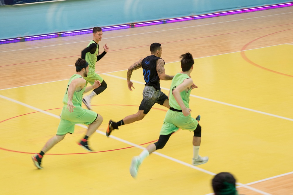 MKAB service members compete in a charity basketball game in Romania