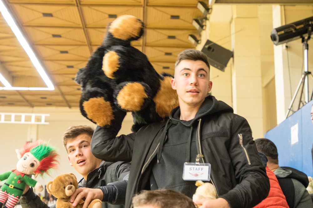 MKAB service members compete in a charity basketball game in Romania