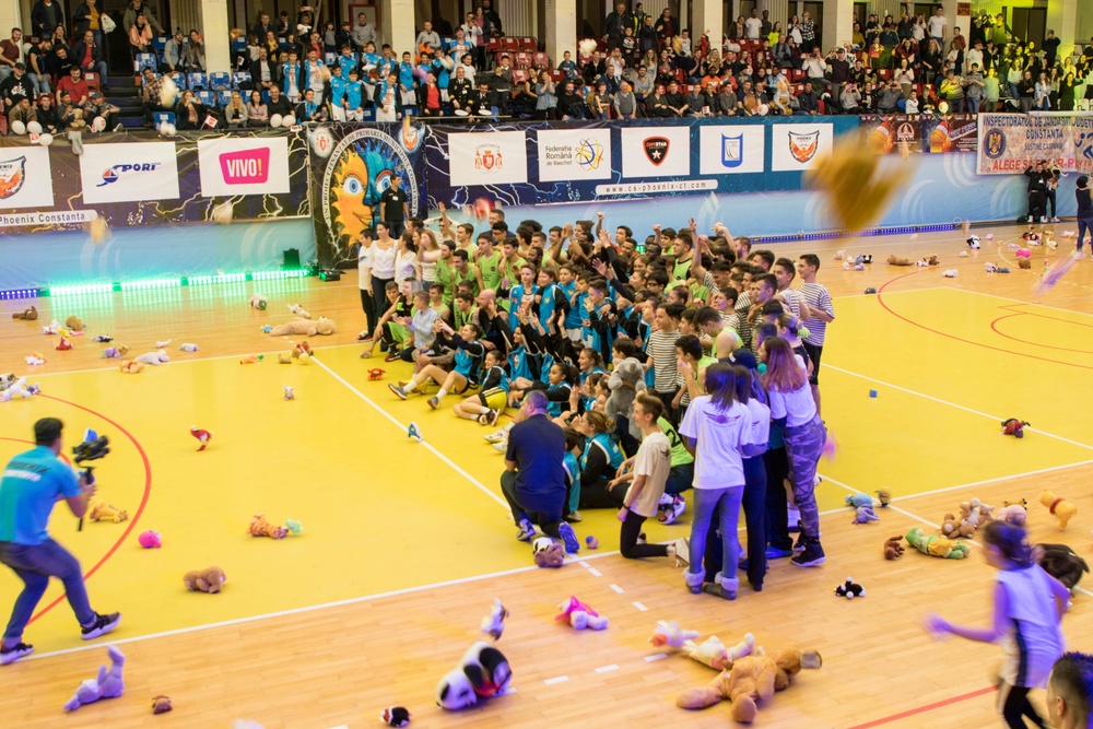 MKAB service members compete in a charity basketball game in Romania