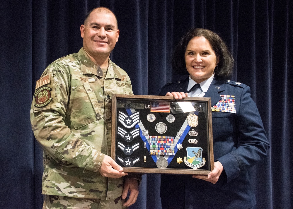 Lt. Col. Shelly Assiff receives her shadow box at her retirement ceremony