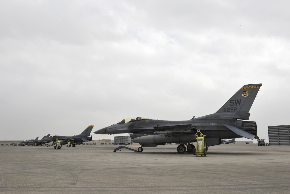 F-16 Fighting Falcons land at Al Udeid Air Base