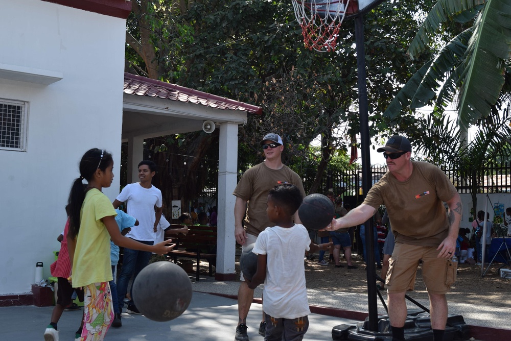 U.S. Navy Seabees deployed with NMCB-5’s Detail Timor-Leste volunteer at a local orphanage