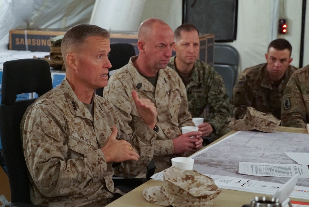 Lt. Gen. Carl E. Mundy III speaks during a briefing at PSAB