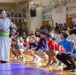 Sumo wrestlers introduce their profession to children at Lester Middle School