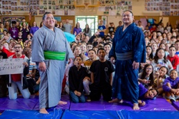 Sumo wrestlers introduce their profession to children at Lester Middle School