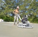 U.S. Navy Seabees from NMCB 5’s Detail Diego Garcia place concrete in support of the U.S. Air Force