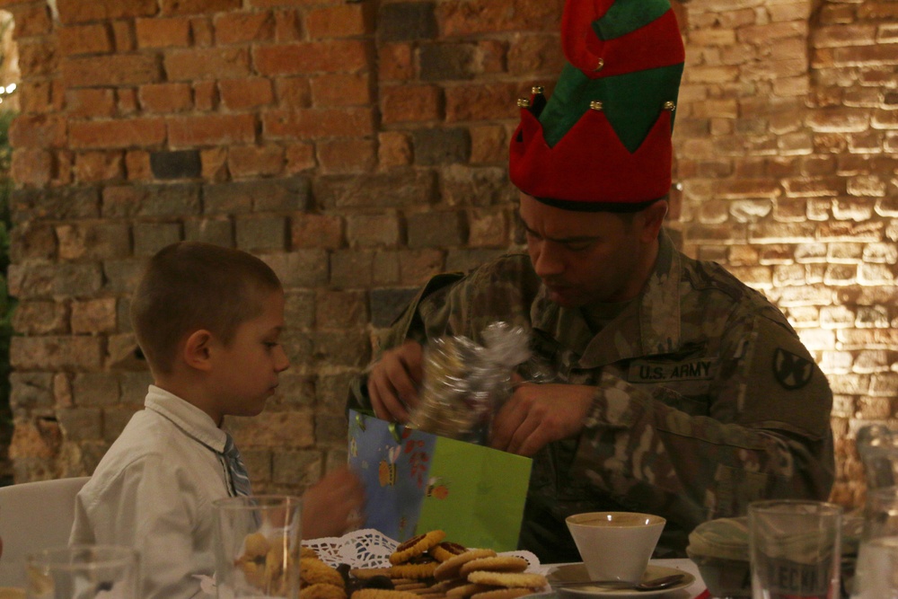 Area Support Group Soldiers bring holiday cheer to local children