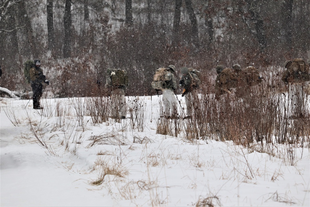 Fort McCoy Cold-Weather Operations Course students practice snowshoeing, conduct field ops