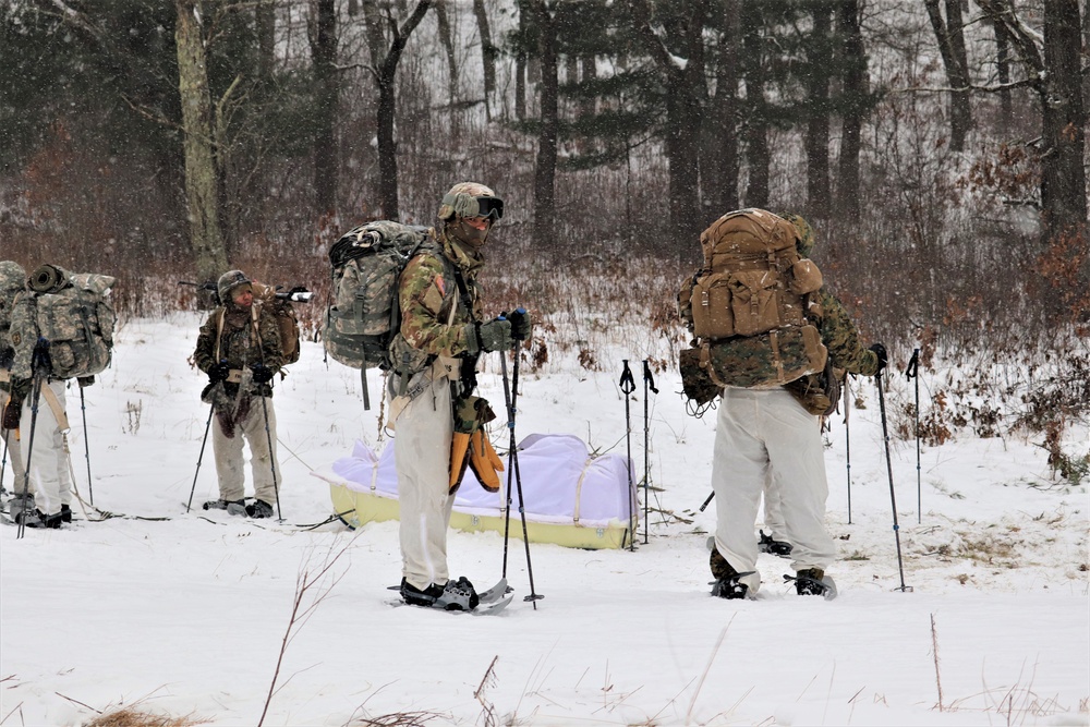 Fort McCoy Cold-Weather Operations Course students practice snowshoeing, conduct field ops