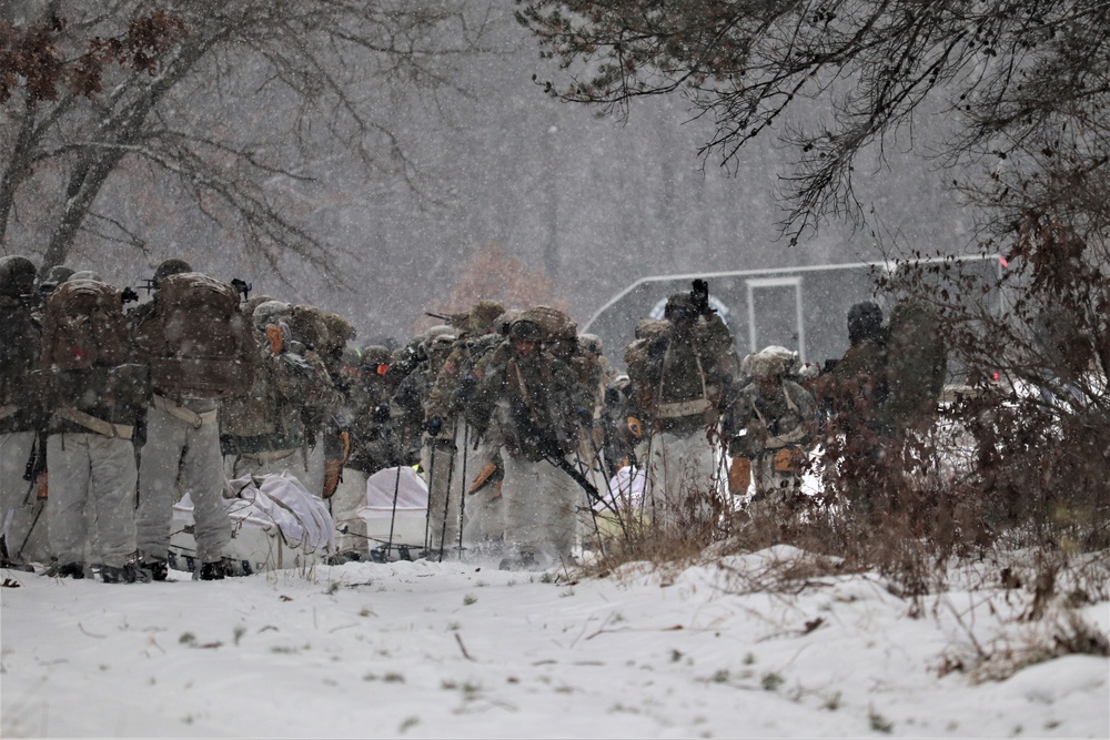 Fort McCoy Cold-Weather Operations Course students practice snowshoeing, conduct field ops