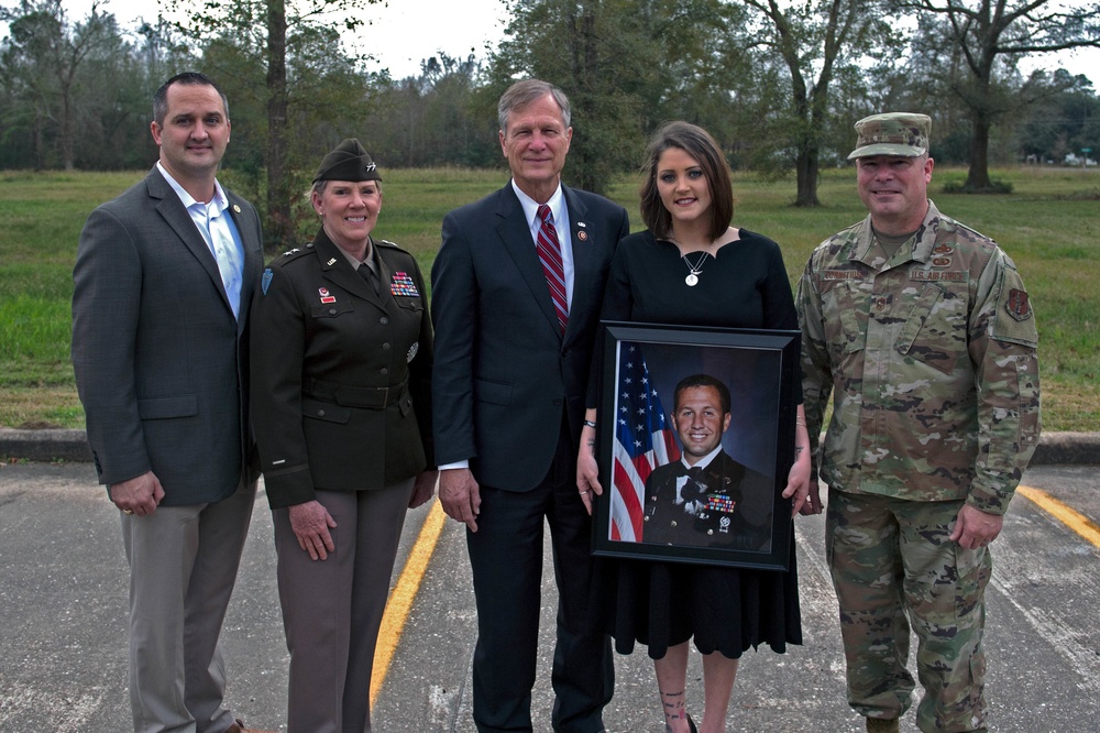 Major General Tracy R. Norris, the Adjutant General of Texas, attends a ceremony dedicating the Hardin, Texas Post Office in honor of Chief Warrant Officer 2 Lucas Lowe.