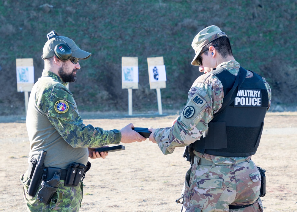 U.S. and Canadian military police conduct weapons training in Romania