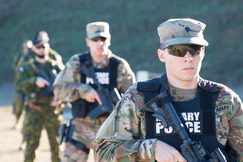 U.S. and Canadian military police conduct weapons training in Romania