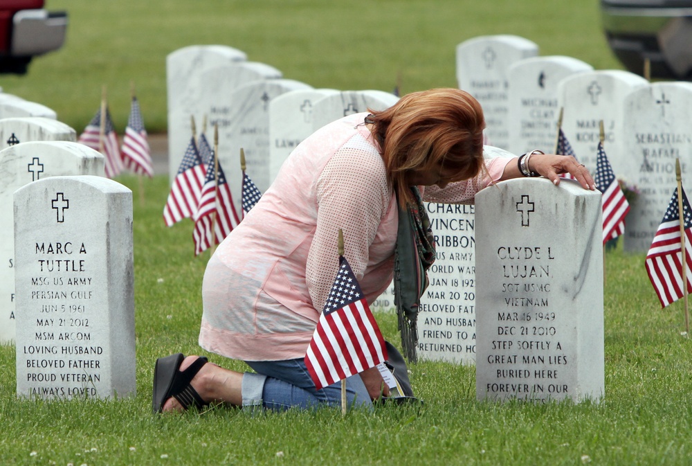 Annemarie Lujan visits her husband's grave on Memorial Day 2019