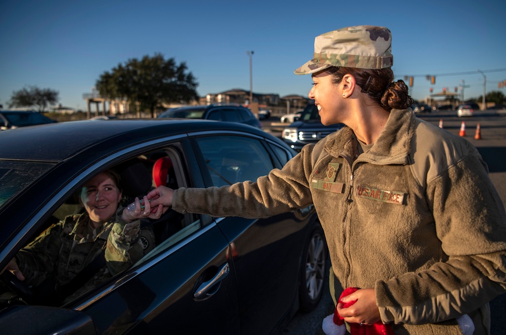 Volunteers show commuters ‘We Care’ at JBSA-Lackland entry gates