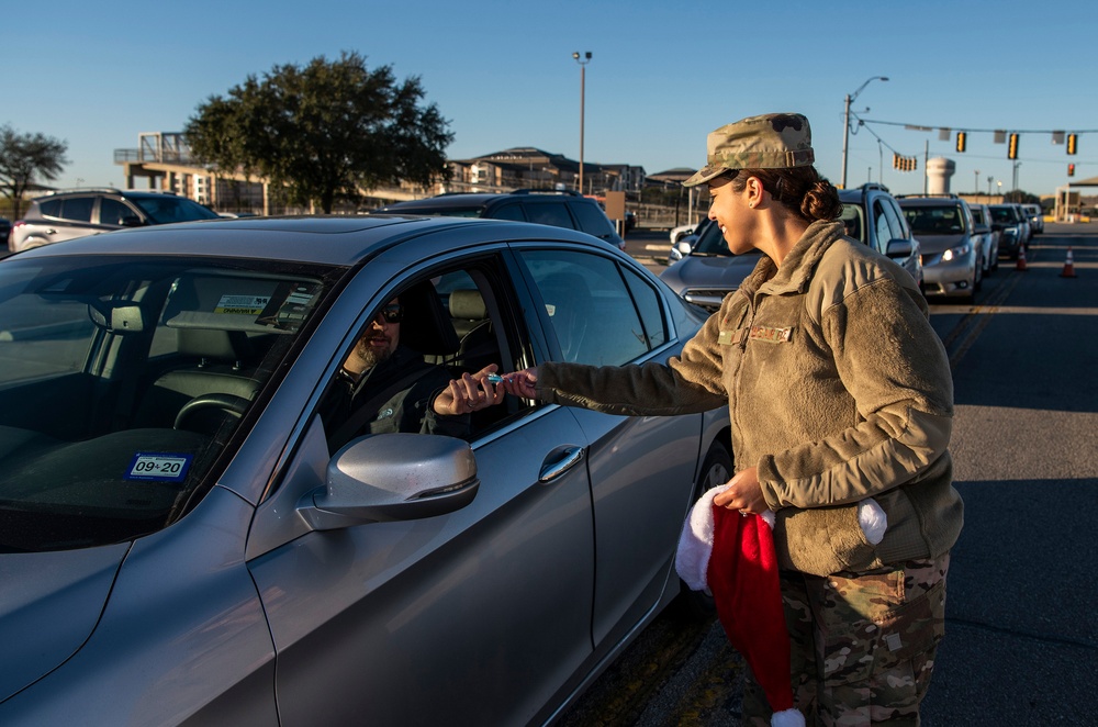 Volunteers show commuters ‘We Care’ at JBSA-Lackland entry gates