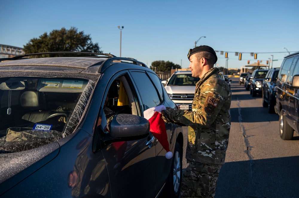 Volunteers show commuters ‘We Care’ at JBSA-Lackland entry gates