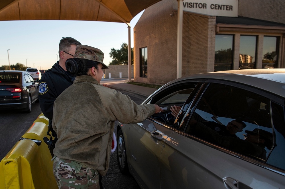 Volunteers show commuters ‘We Care’ at JBSA-Lackland entry gates