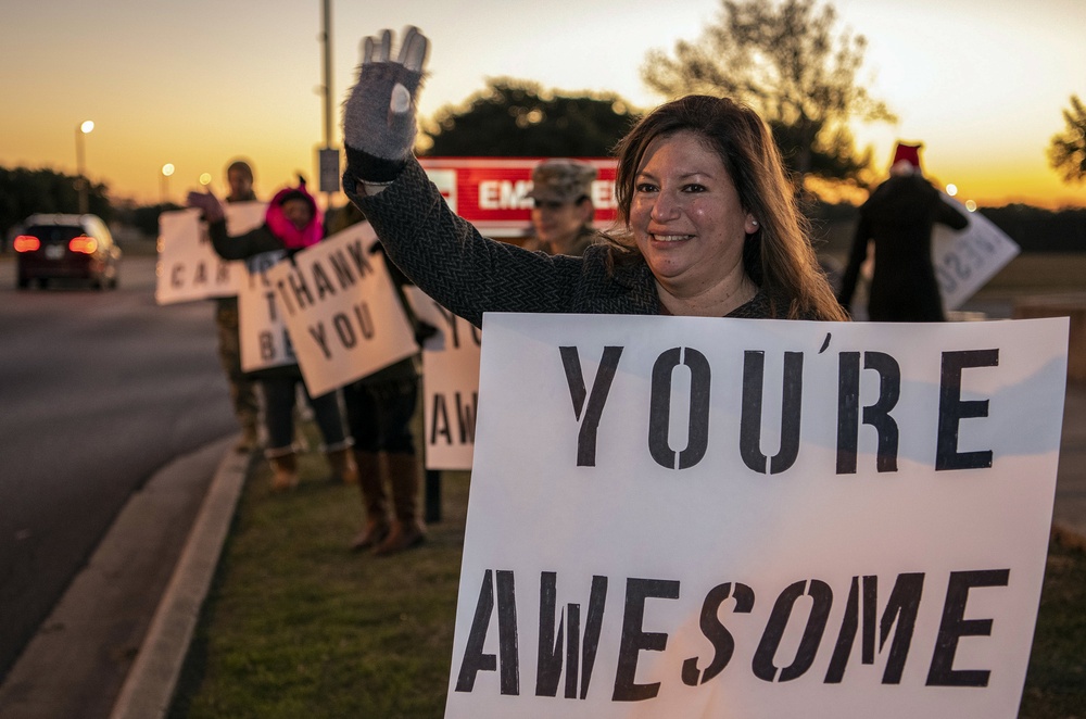 Volunteers show commuters ‘We Care’ at JBSA-Lackland entry gates