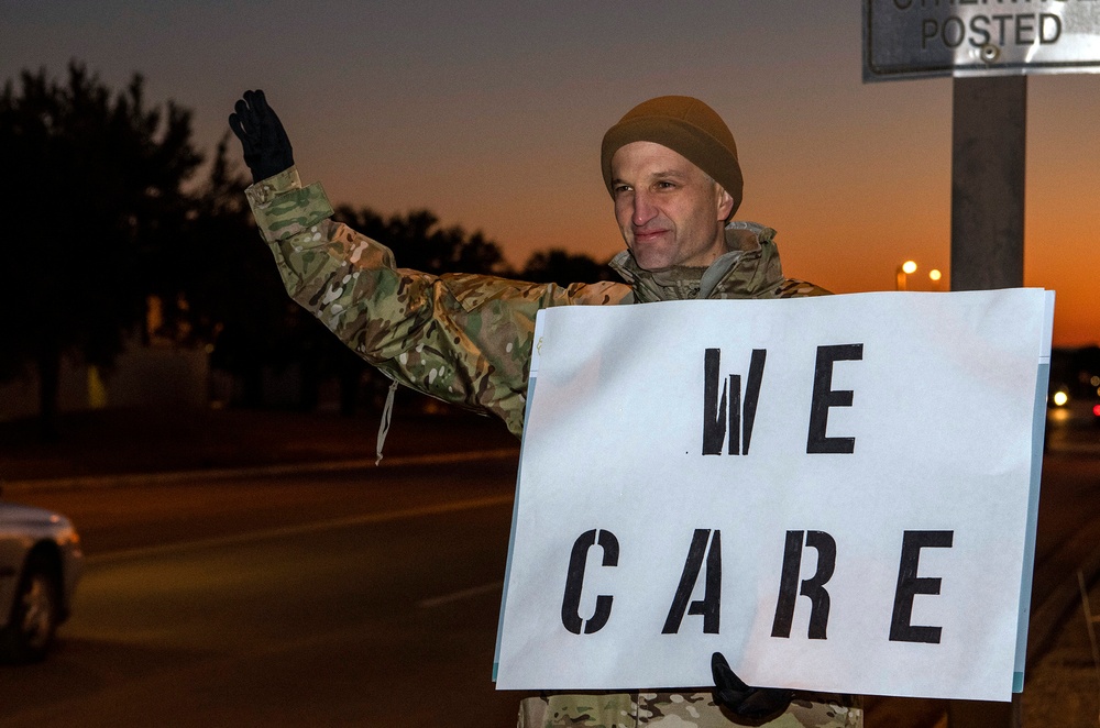 Volunteers show commuters ‘We Care’ at JBSA-Lackland entry gates