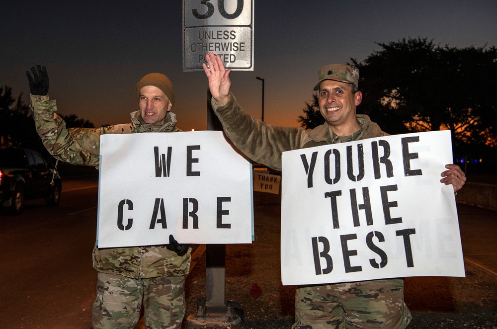 Volunteers show commuters ‘We Care’ at JBSA-Lackland entry gates