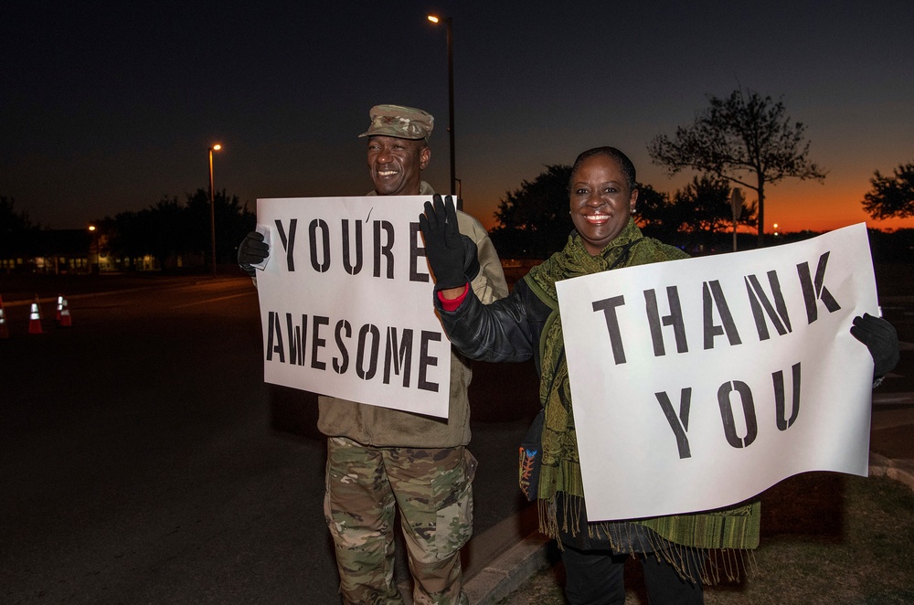 Volunteers show commuters ‘We Care’ at JBSA-Lackland entry gates