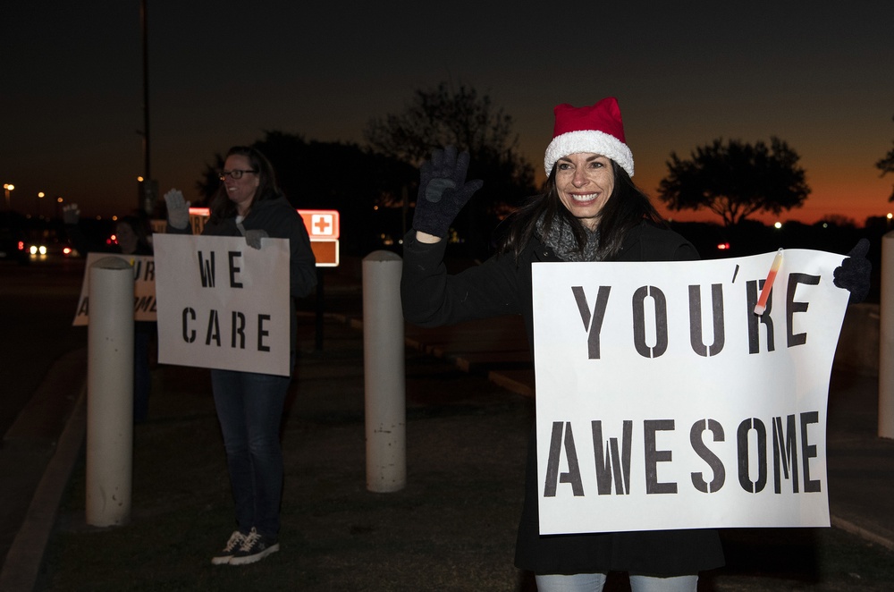 Volunteers show commuters ‘We Care’ at JBSA-Lackland entry gates