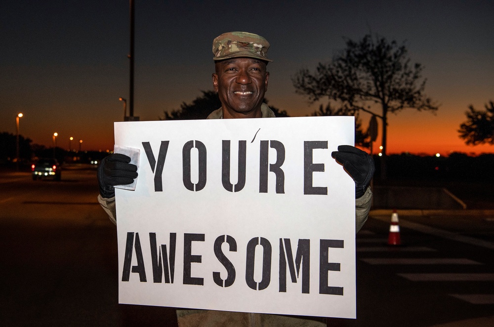 Volunteers show commuters ‘We Care’ at JBSA-Lackland entry gates