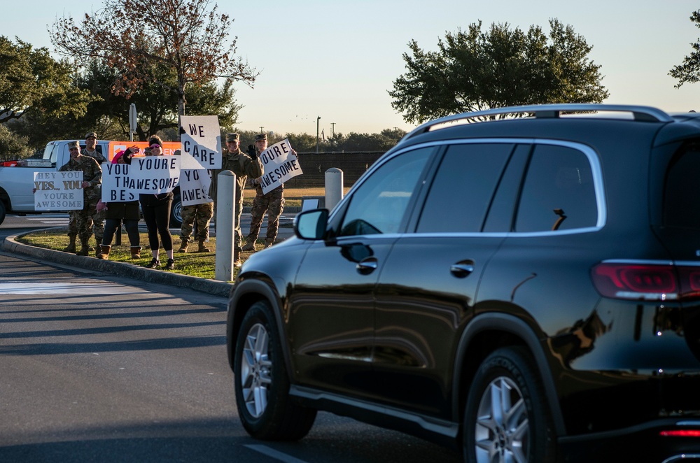 Volunteers show commuters ‘We Care’ at JBSA-Lackland entry gates