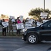 Volunteers show commuters ‘We Care’ at JBSA-Lackland entry gates