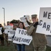 Volunteers show commuters ‘We Care’ at JBSA-Lackland entry gates