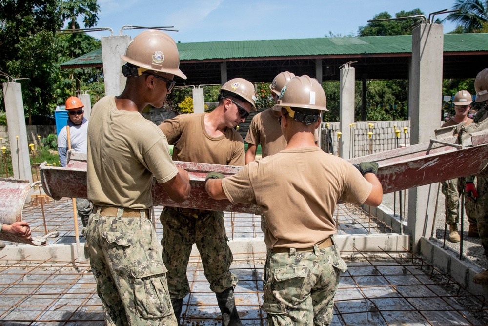 U.S. Navy Seabees deployed with NMCB-5’s Detail Palawan continue construction on Malatgao Elementary School