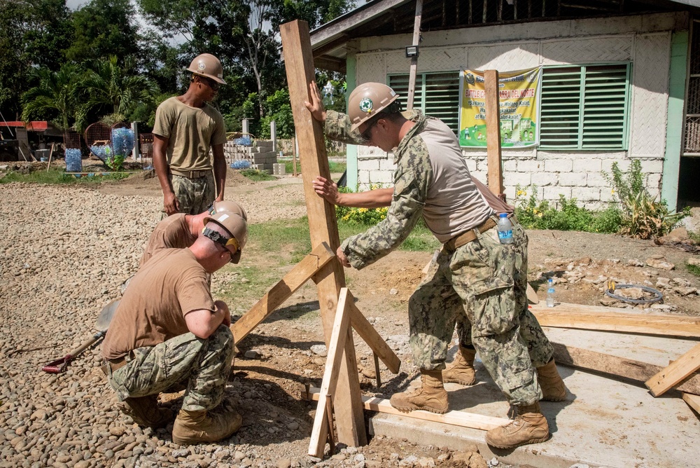 U.S. Navy Seabees deployed with NMCB-5’s Detail Palawan continue construction on Malatgao Elementary School