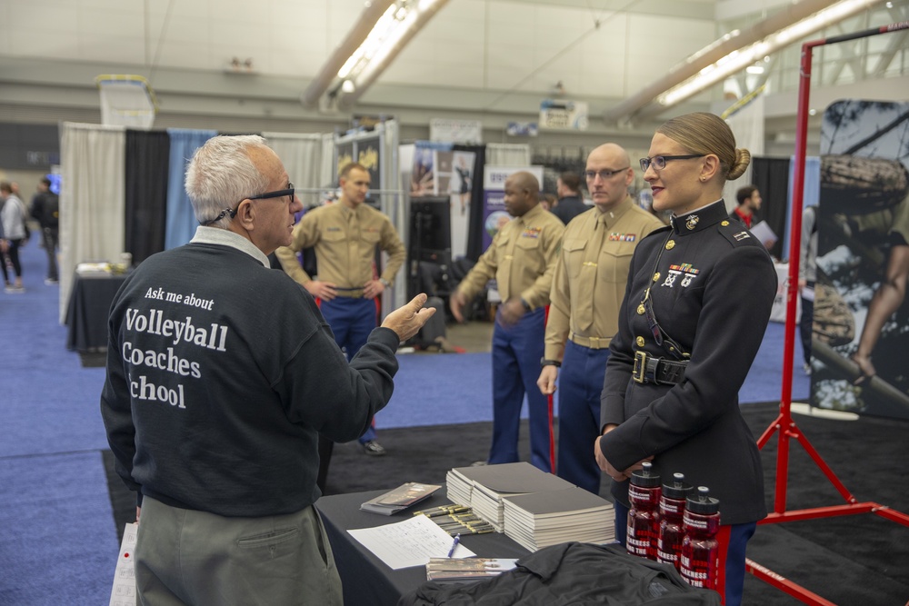 Marines engage with coaches at the American Volleyball Coaches Association 2019 National Convention