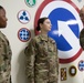 Lt. Gen. Charles D. Luckey presents U.S. Army Staff Sgt. Eileen Crandall with a command coin