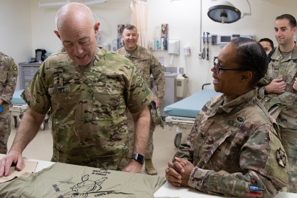 Lt. Gen. Charles D. Luckey is presented with a unit T-shirt