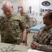 Lt. Gen. Charles D. Luckey is presented with a unit T-shirt