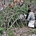 Cold-Weather Operations Course students build improvised shelters, survive outdoors