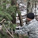 Cold-Weather Operations Course students build improvised shelters, survive outdoors