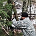 Cold-Weather Operations Course students build improvised shelters, survive outdoors