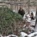 Cold-Weather Operations Course students build improvised shelters, survive outdoors