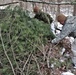 Cold-Weather Operations Course students build improvised shelters, survive outdoors