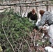 Cold-Weather Operations Course students build improvised shelters, survive outdoors