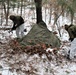 Cold-Weather Operations Course students build improvised shelters, survive outdoors