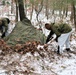 Cold-Weather Operations Course students build improvised shelters, survive outdoors