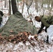 Cold-Weather Operations Course students build improvised shelters, survive outdoors