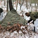 Cold-Weather Operations Course students build improvised shelters, survive outdoors