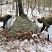 Cold-Weather Operations Course students build improvised shelters, survive outdoors