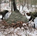 Cold-Weather Operations Course students build improvised shelters, survive outdoors